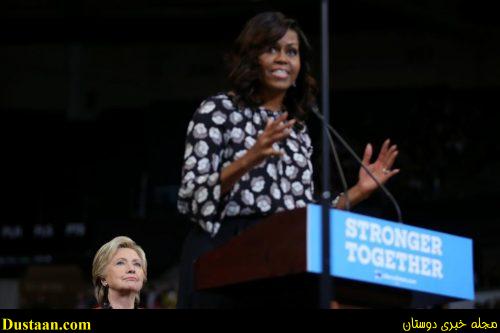 Hillary Clinton listens as Michelle Obama speaks during a campaign rally in Winston-Salem. REUTERS/Carlos Barria