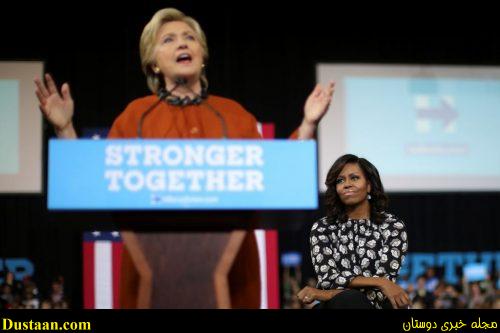 Michelle Obama listens as Hillary Clinton speaks at a campaign rally in Winston-Salem. REUTERS/Carlos Barria