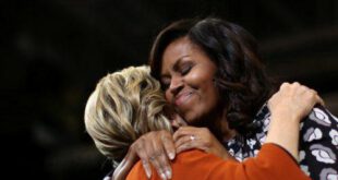 First lady Michelle Obama embraces Democratic presidential candidate Hillary Clinton as they arrive at a campaign rally in Winston-Salem, North Carolina, October 27, 2016. REUTERS/Carlos Barria